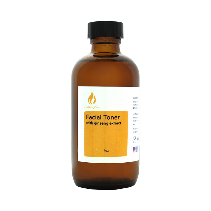 Bottle of facial toner with ginseng extract on a white background with green leaves.